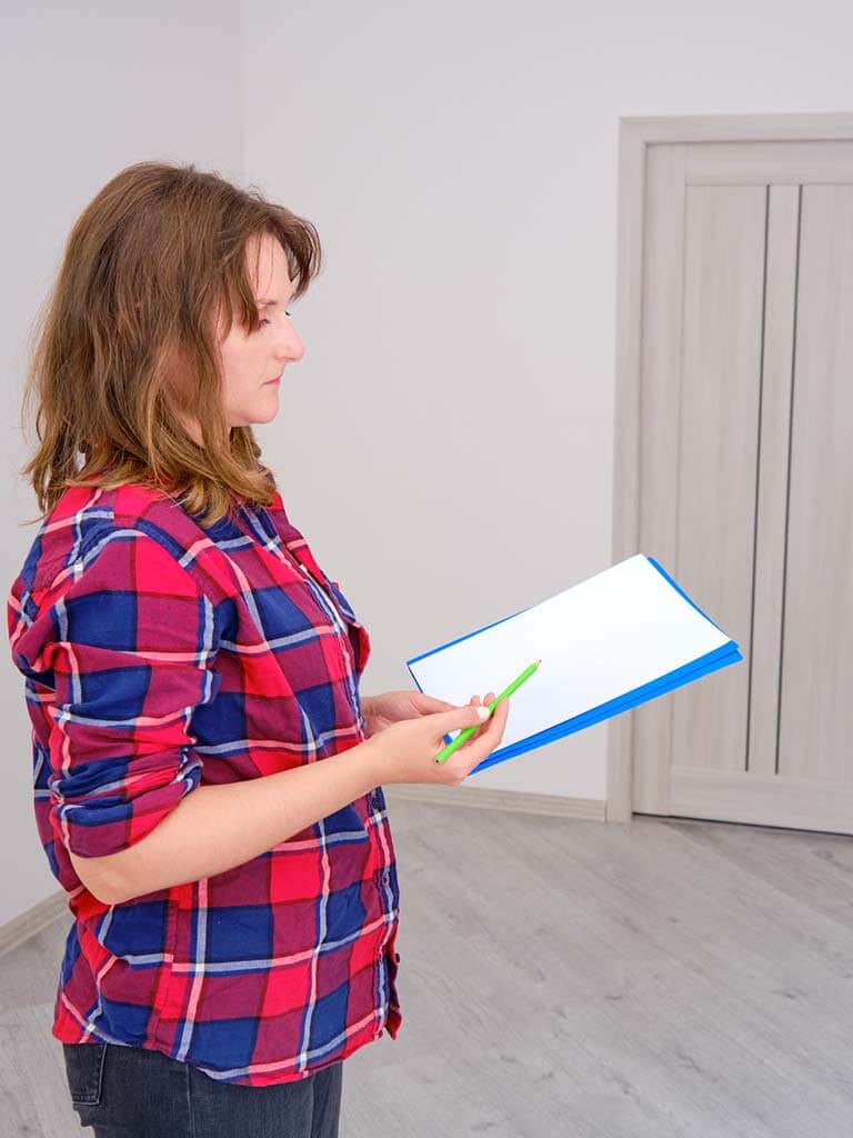 Woman inspecting new house